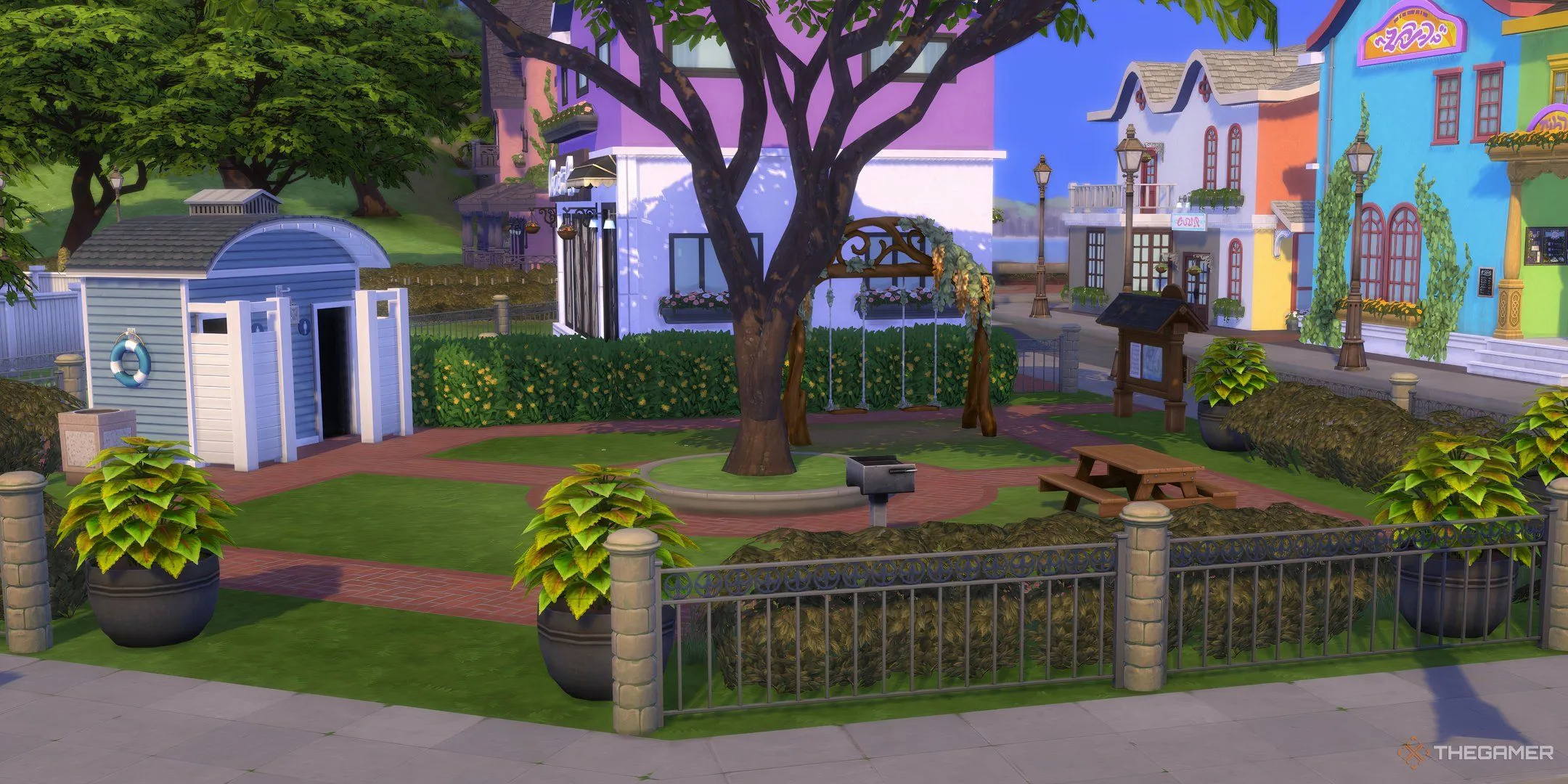 Một công viên nhỏ với xích đu, lò nướng và nhà vệ sinh ở Bờ biển Adhmor trong The Sims 4 Enchanted By Nature.