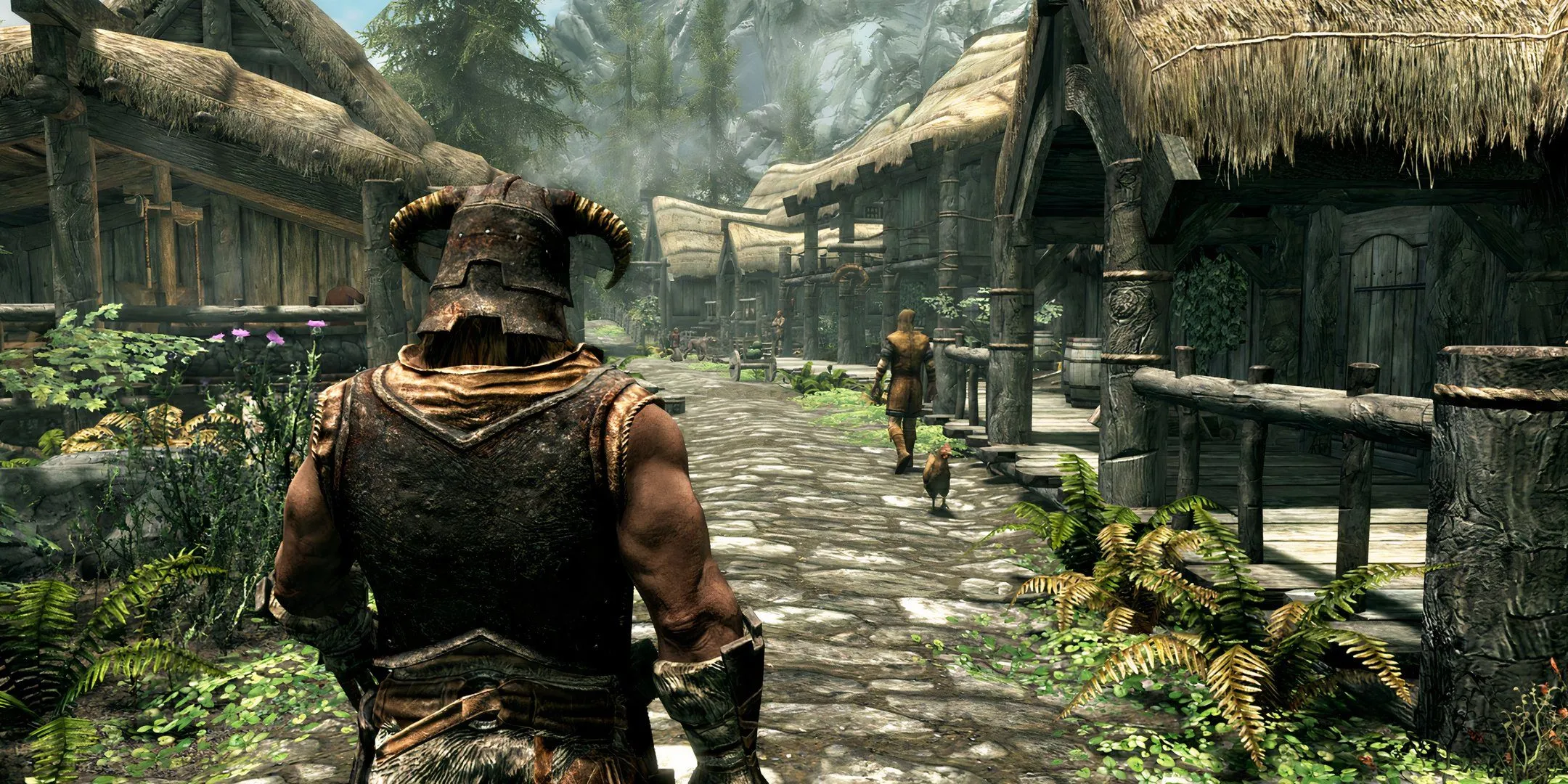 Nhân vật người chơi đang đi qua một thị trấn trong Skyrim, một tựa game nhập vai thế giới mở mà nhiều người chưa hoàn thành