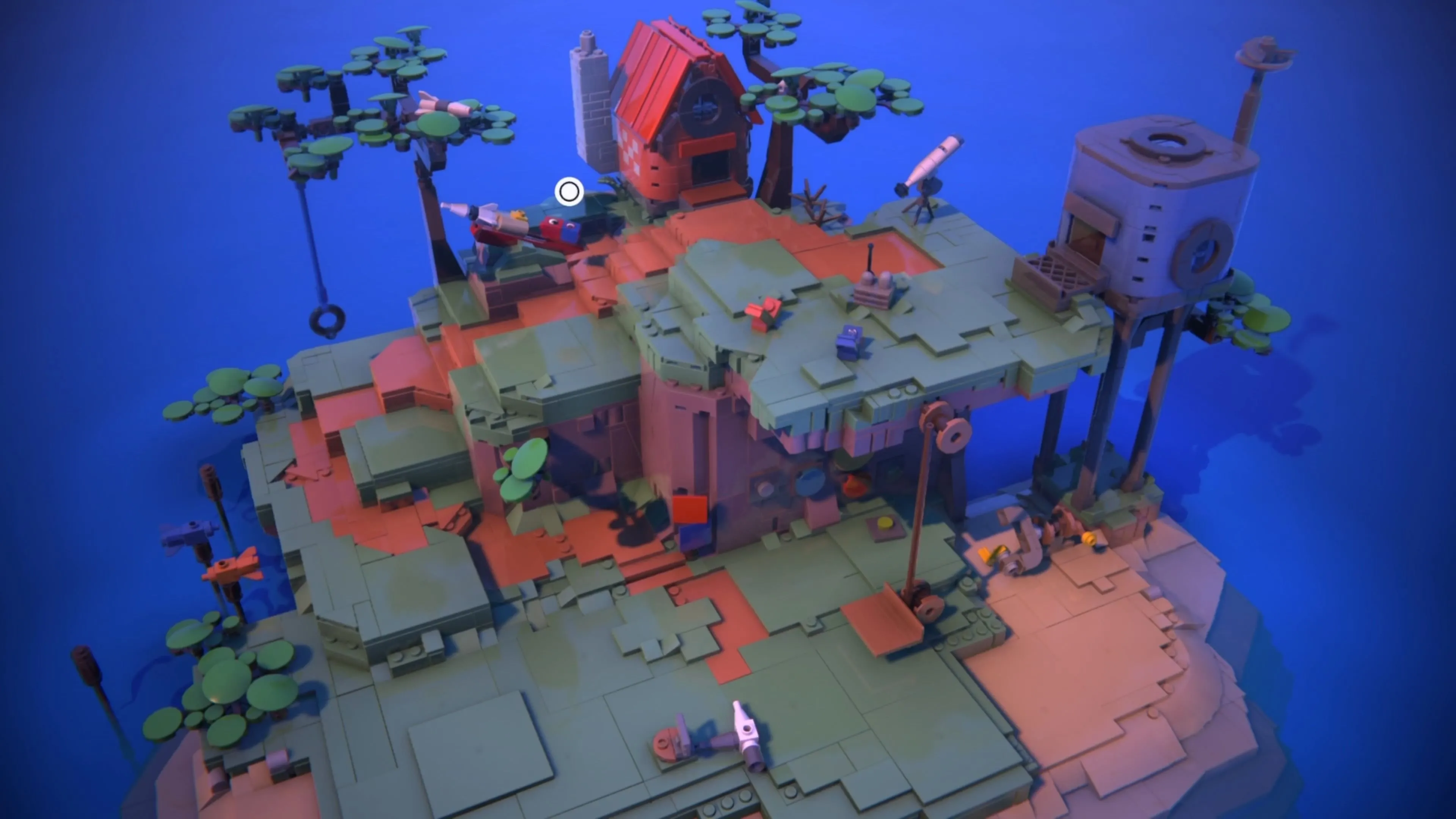 Hai nhân vật Red và Blue tương tác với đồ chơi trên Đảo Nhà trong LEGO Voyagers