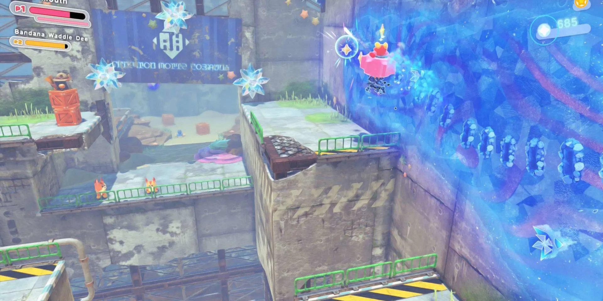 Kirby ở dạng Gear Mouthful Mode, di chuyển qua một khu vực cơ khí trong Kirby: Star-Crossed World