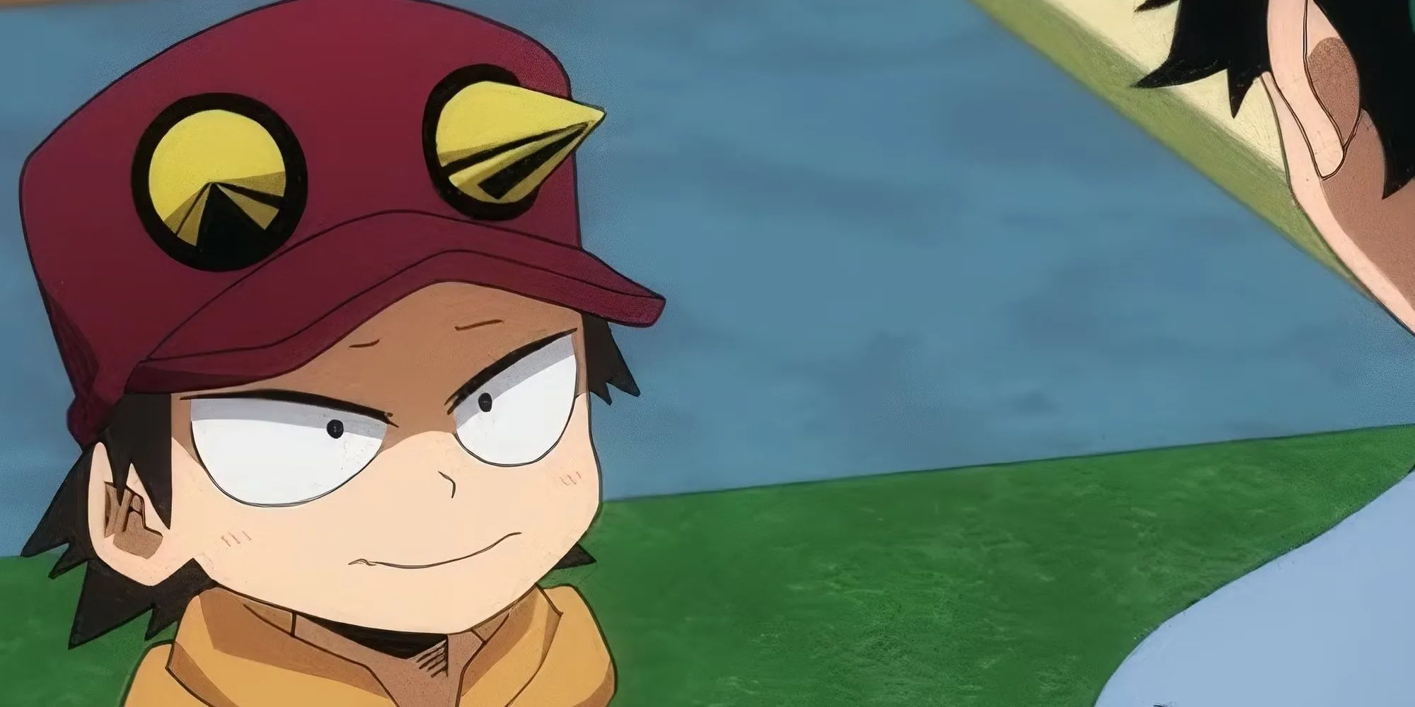 Kota Izumi, cậu bé mồ côi cha mẹ anh hùng, trong bộ trang phục đặc trưng và chiếc mũ đỏ trong My Hero Academia.